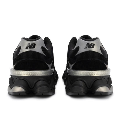 Black and silver New Balance sneakers on a white background